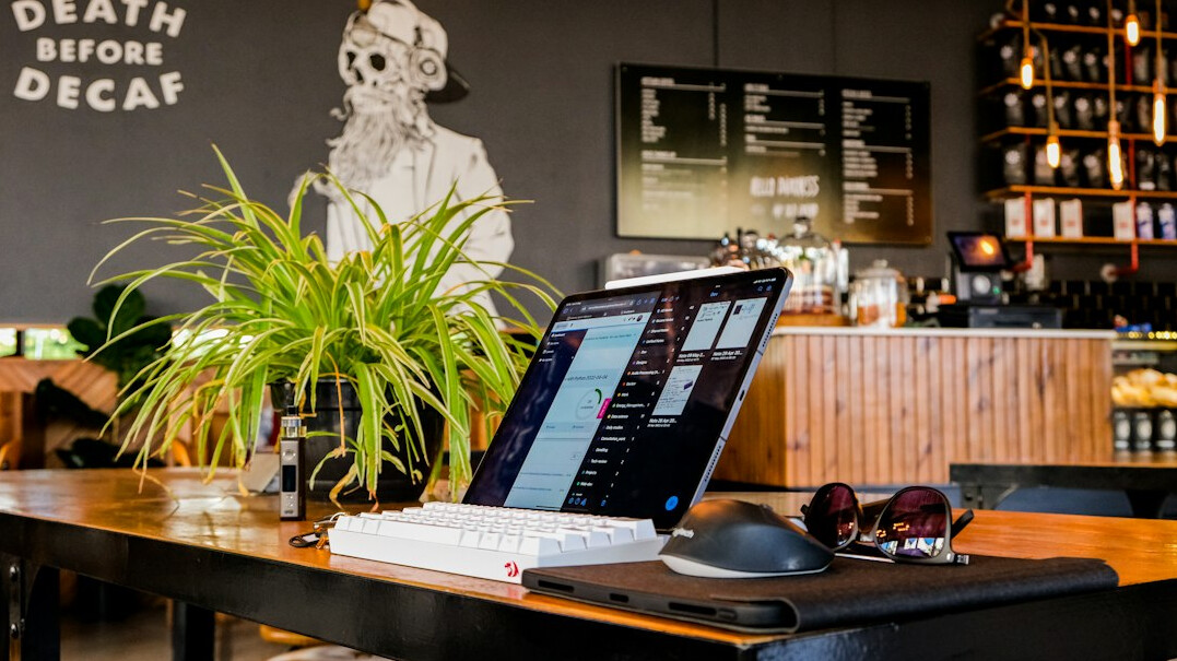 Laptop with a production dashboard on a desk